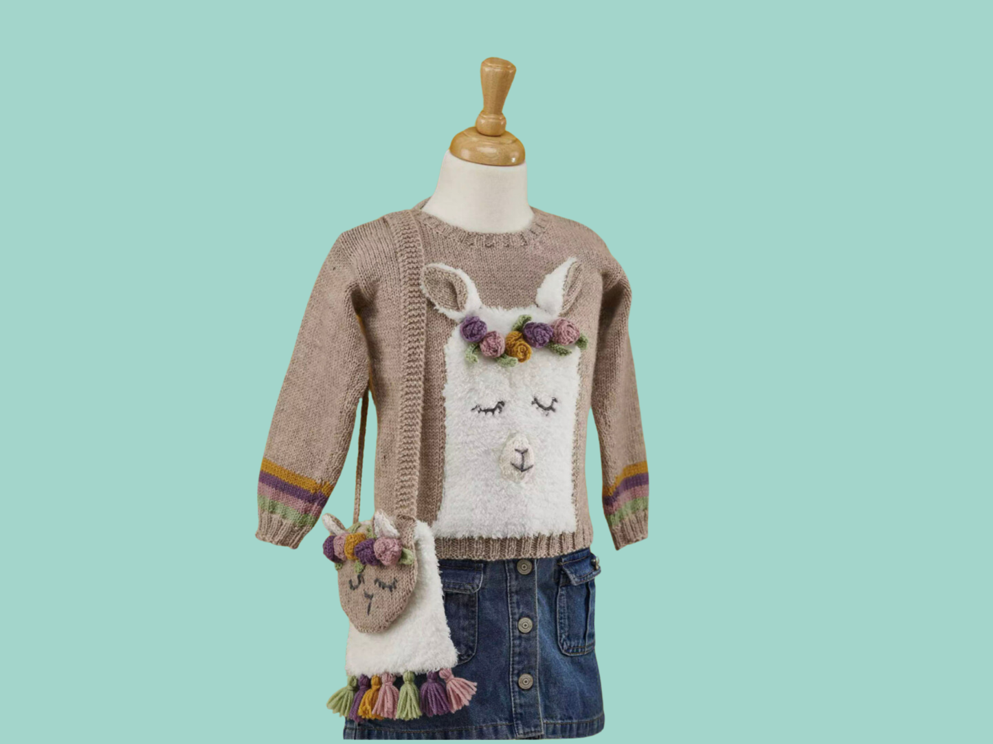 knitting pattern for a fluffy llama kids jumper. beige jumper with pastel stripes around cuff. fluffy llama head with applique ears and roses form this sleepy llama. Llama sweater knitting pattern by jane burns download