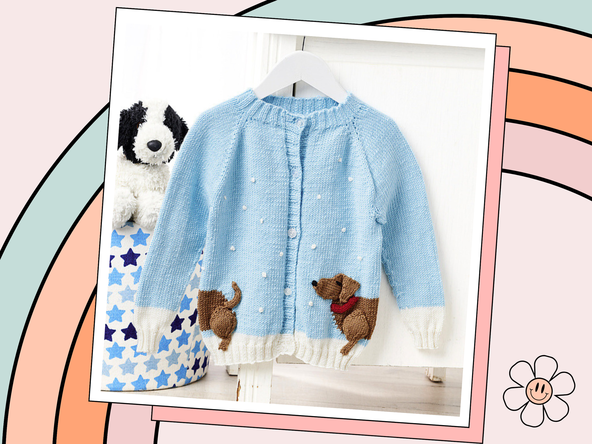 Dachshund in the snow, a kids cardigan knitting pattern with a wrap around intarsia sausage dog with knitted applique elements to bring it to life. Seamless top down cardigan knitting pattern for children by jane burns