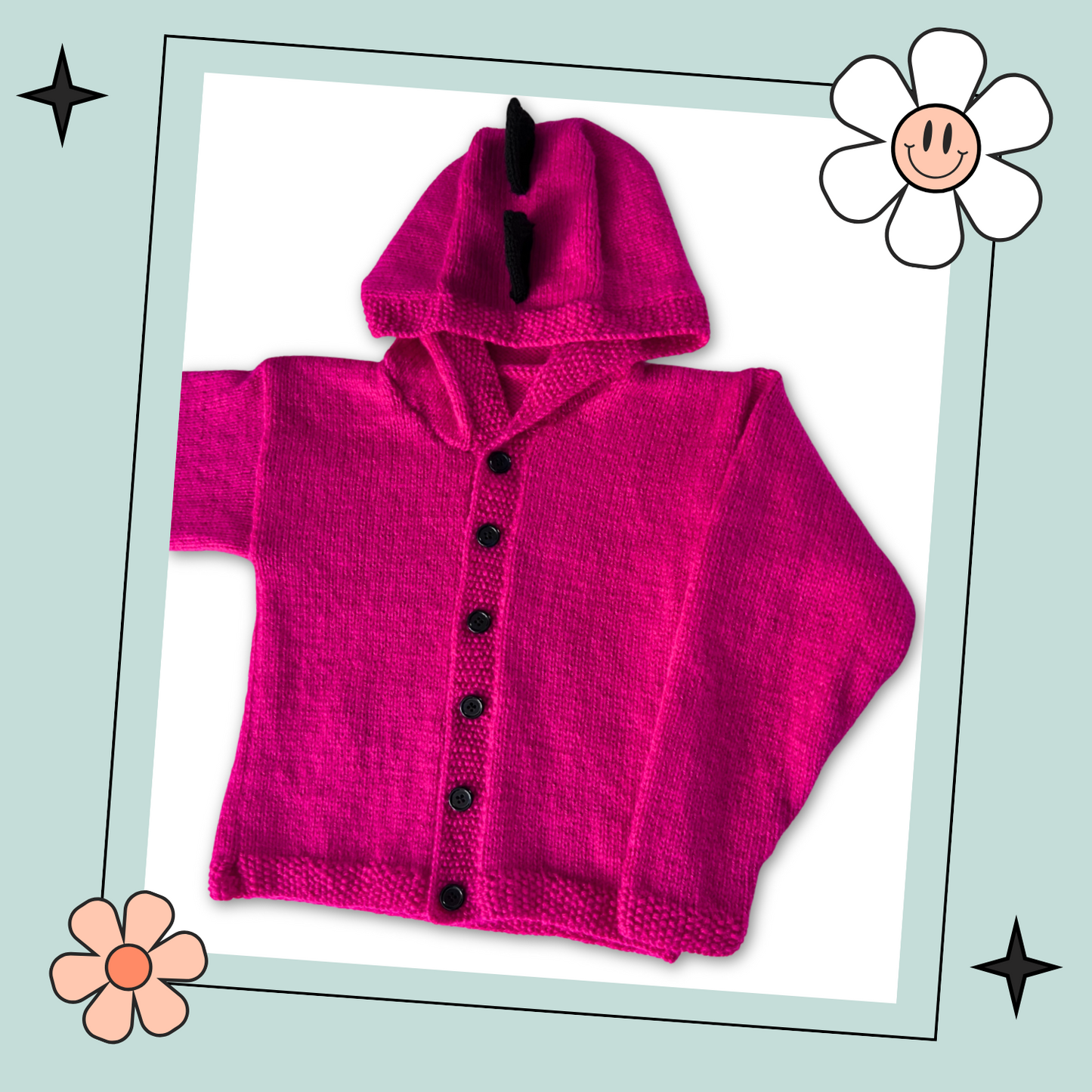Pink knitted hoodie with cartoon face design on the back and black spikes on the hood, knitting pattern for kids hooded cardigan jane burns