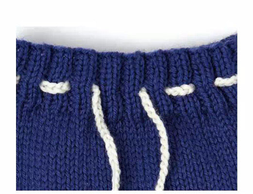 knitting pattern for baby hat and shorts set, pirate eye patch on the baby beanie hat and pirate flag motif on the baby knitted shorts, jane burns knitting pattern download