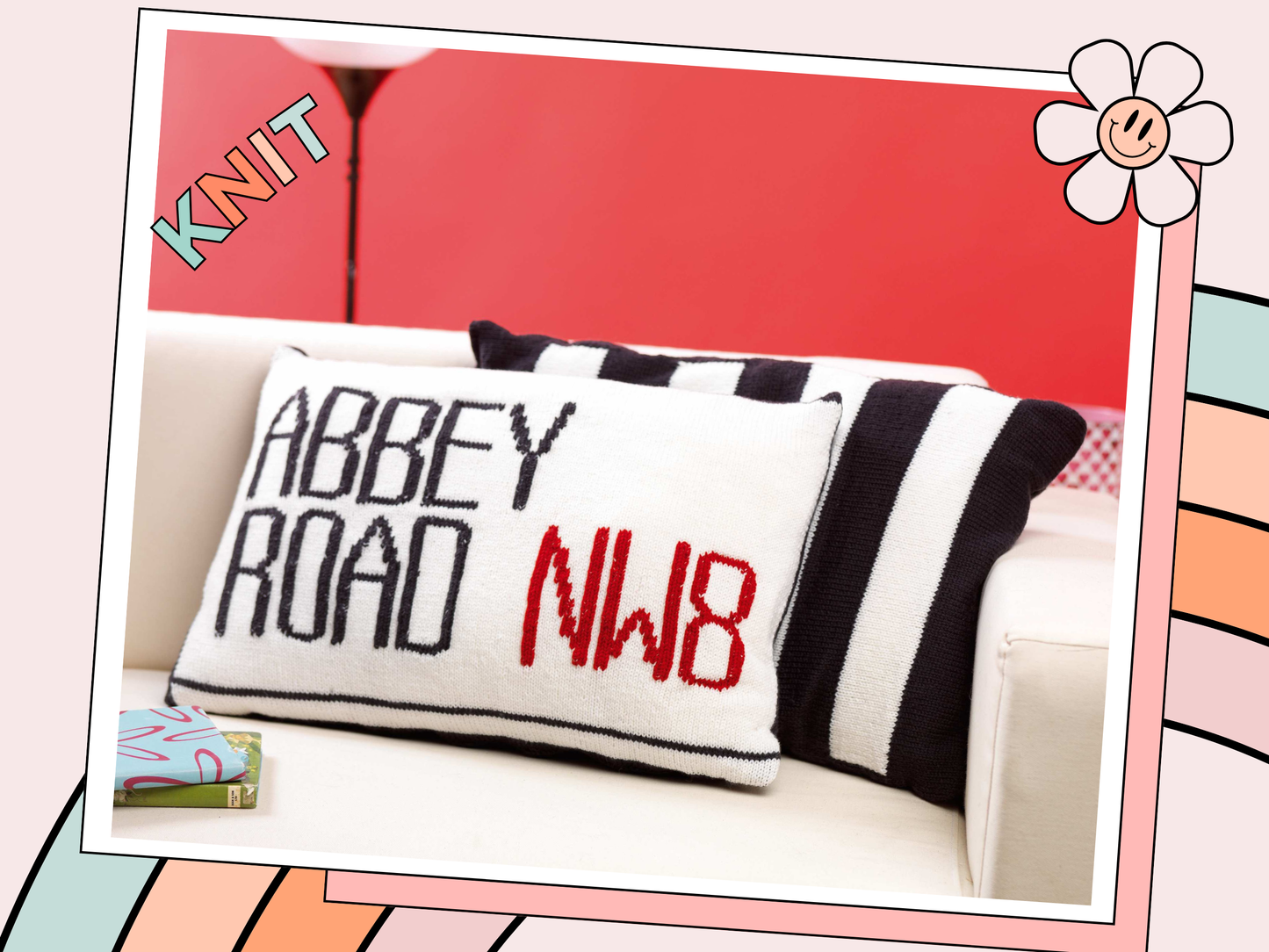 Image shows two knitted cushions one showing the abbey road street sign and behind it a second black and white striped cushion looking like the zebra crossing from the beatles music album knitting pattern by jane burns
