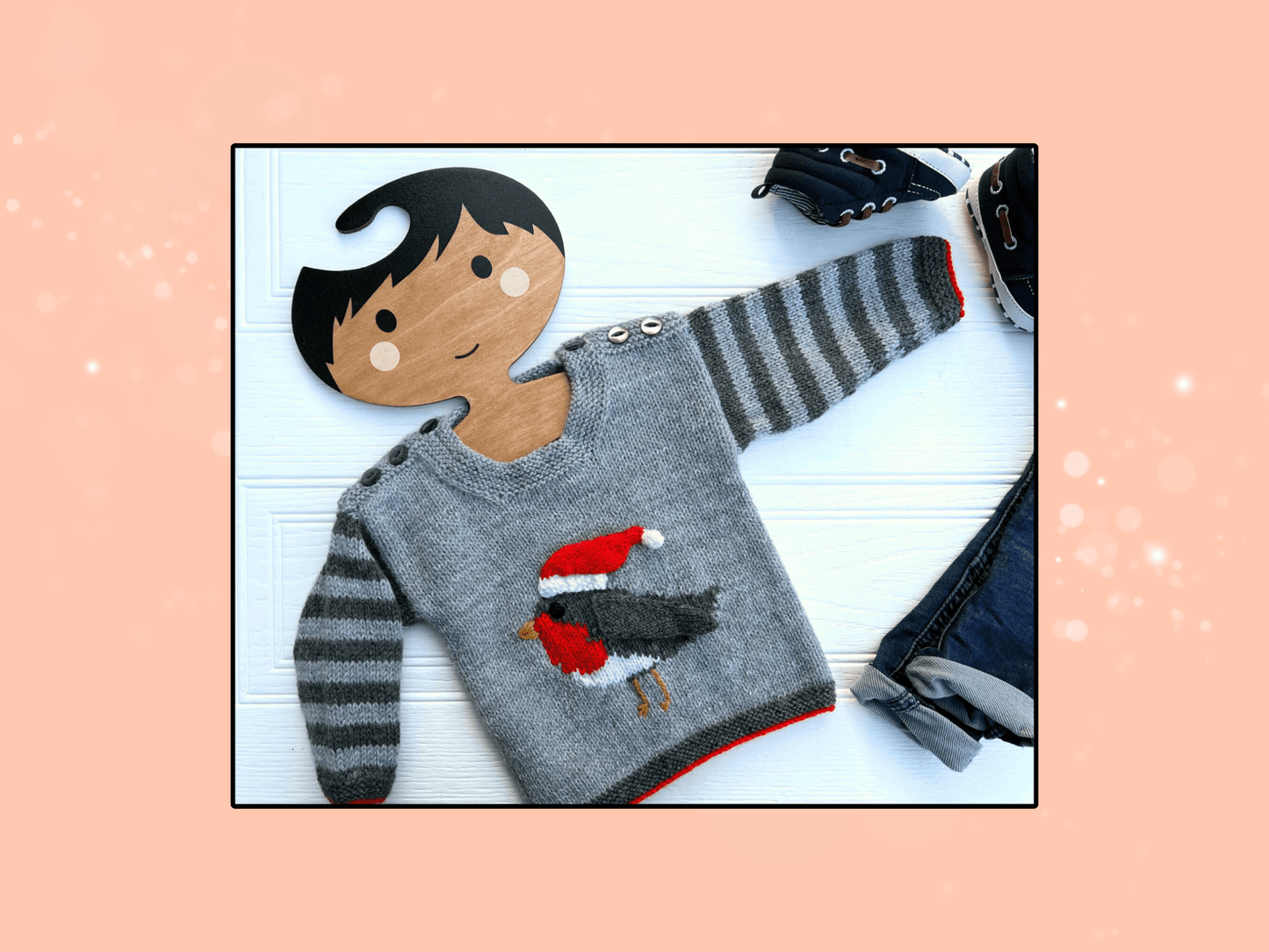 Baby robin Christmas jumper front view, intarsia panel with removable Santa hat