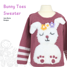 Load image into Gallery viewer, Pink kids sweater with white fluffy bunny motif, large floppy ears and applique flower garland on its head. Big bunny feet with pink toes. Knitting pattern by Jane Burns Designs
