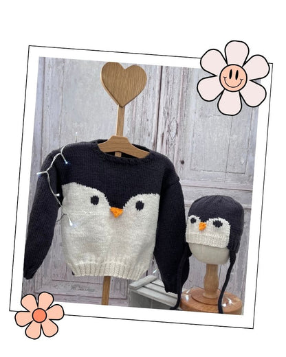 Baby penguin jumper and matching aviator hat on display stands, DK knitting pattern for 0 months to 5 years