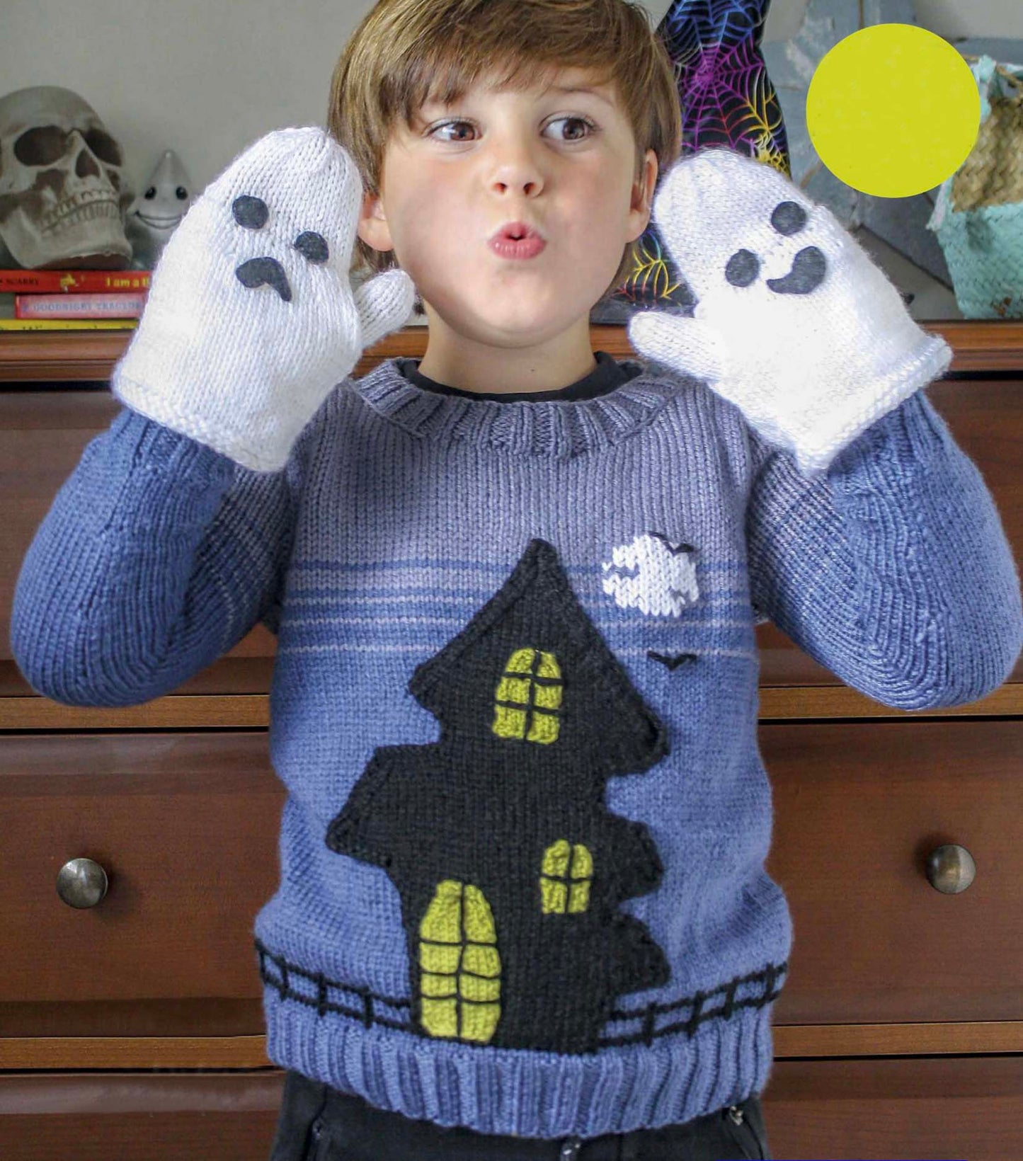 knitting pattern for a blue kids jumper, large black spooky ghost house on the front which has pockets, ghost mittens for child, dk yarn, kids sweater knitting pattern, spooky, halloween, halloween jumper