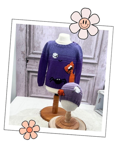A purple knit sweater displayed on a mannequin torso, with a matching purple knit hat on a small mannequin head. The sweater features cartoon spider and cat motifs.