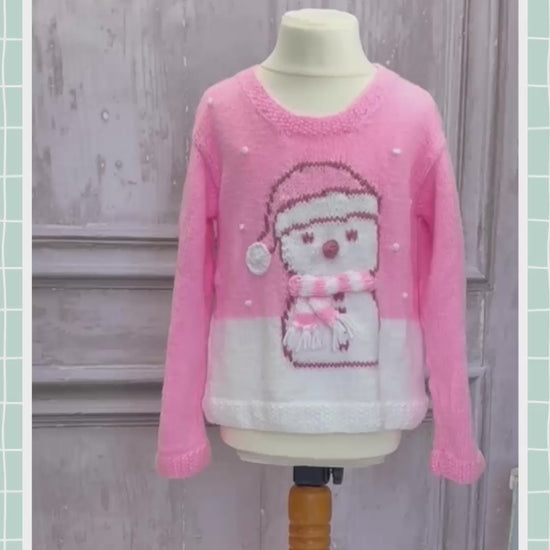 Girls pink Christmas jumper knitting pattern with an intarsia snowman in a bobble hat and stripy scarf, sizes 2 to 11