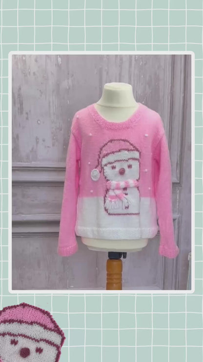 Girls pink Christmas jumper knitting pattern with an intarsia snowman in a bobble hat and stripy scarf, sizes 2 to 11