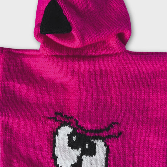 Pink knitted hoodie with cartoon face design on the back and black spikes on the hood, knitting pattern for kids hooded cardigan jane burns