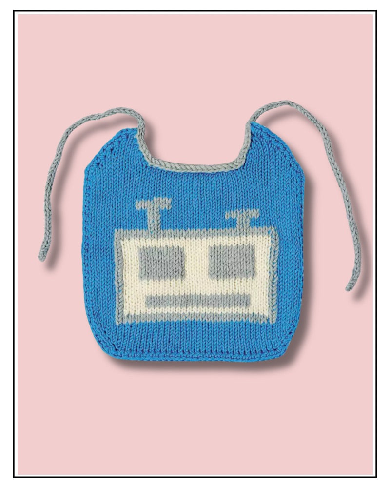 Robot baby bib knitting pattern, blue knitted bib with a cream and silver robot face and silver ties, on a pink background