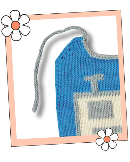 Close up of a silver i-cord tie and the neat edging on a knitted baby bib, robot bib knitting pattern