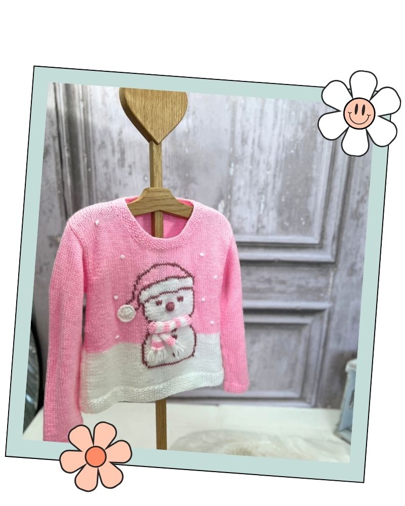 Side view of Snolene the snowman, a pink Christmas jumper knitting pattern for kids in Stylecraft Special DK