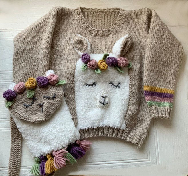 No Drama knitting pattern for a fluffy llama kids jumper. beige jumper with pastel stripes around cuff. fluffy llama head with applique ears and roses form this sleepy llama. Llama sweater knitting pattern by jane burns download