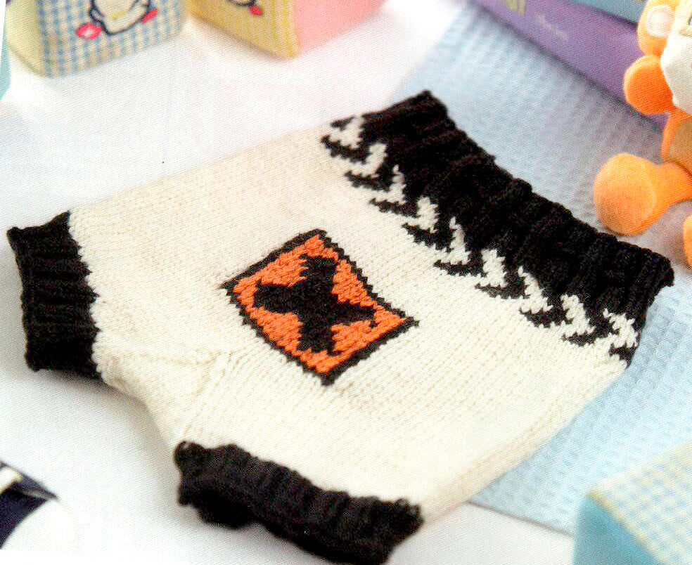 knitting pattern for knitted baby nappy cover, soaker, pants. featuring a toxic waste symbol and skull and cross bones, baby shower, gift, knitting pattern jane burns