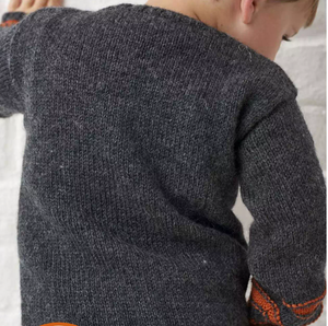 knitting pattern for kids jumper, childs halloween sweater with pumpkin eyes, nose and mouth on the front. Easy kids jumper knitting pattern by jane burns