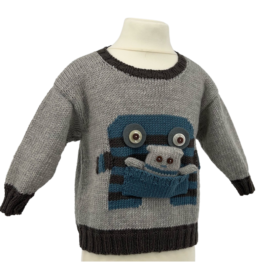 monster motif jumper with large pocket mouth and matching monster toy knitting pattern jane burns